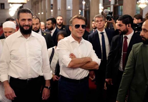 Explosions shake Damascus as Macron visits